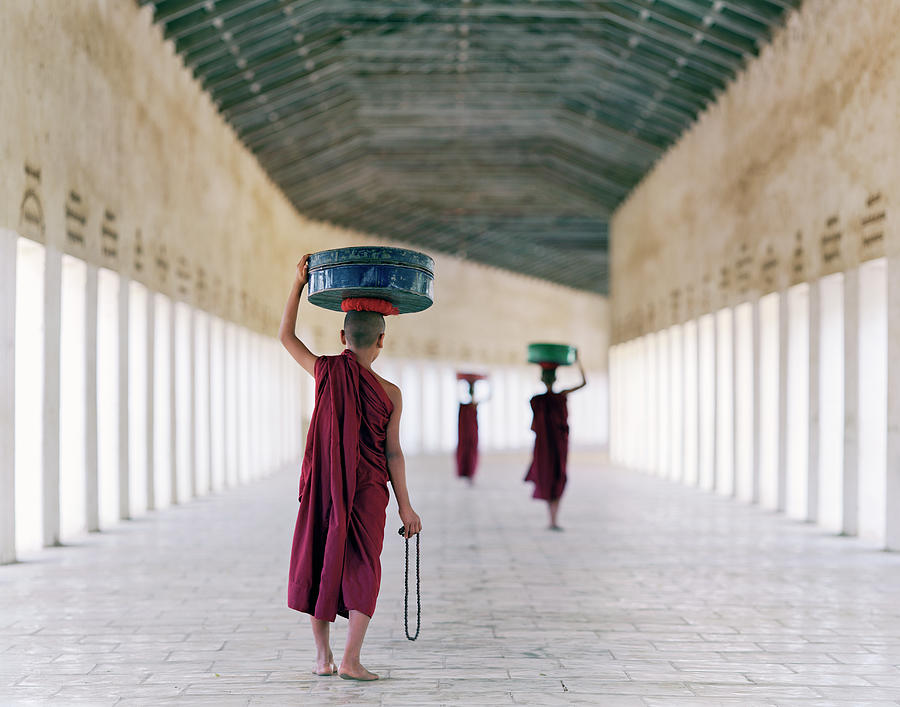 Myanmar, Bagan, Monks In Temple Corridor Photograph by Martin Puddy