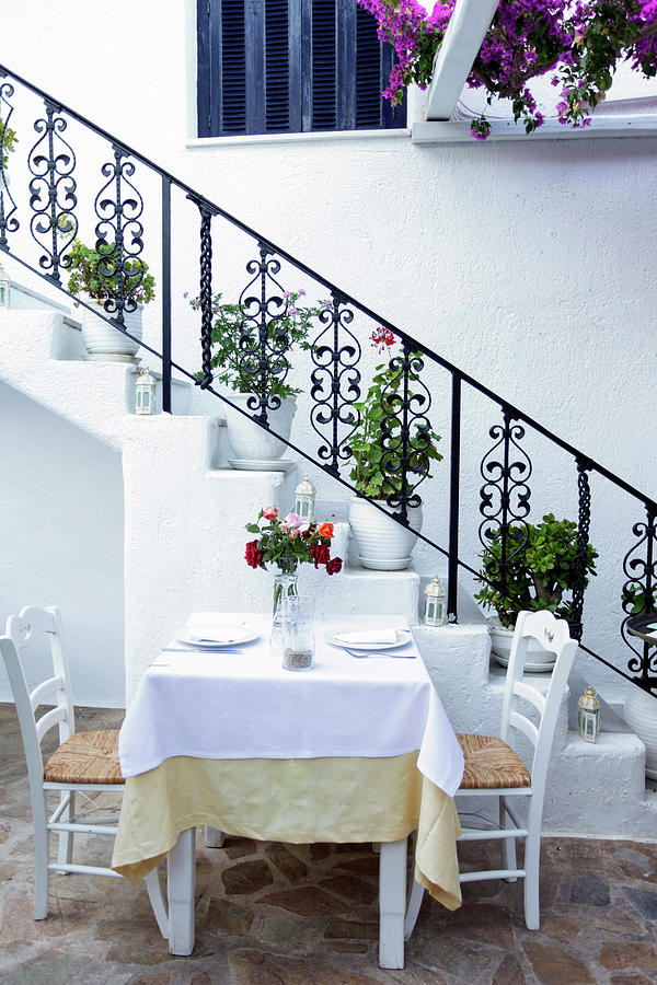 Greek Photograph - Mykonos, Greece Table Set For Two by Julien Mcroberts