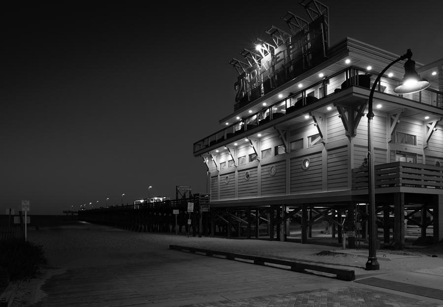 Black And White Photograph - Myrtle Beach 2nd ave Pier at Night by Ivo Kerssemakers