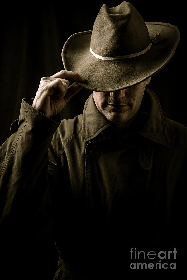 Mysterious man in hat and trench coat Photograph by Edward Fielding