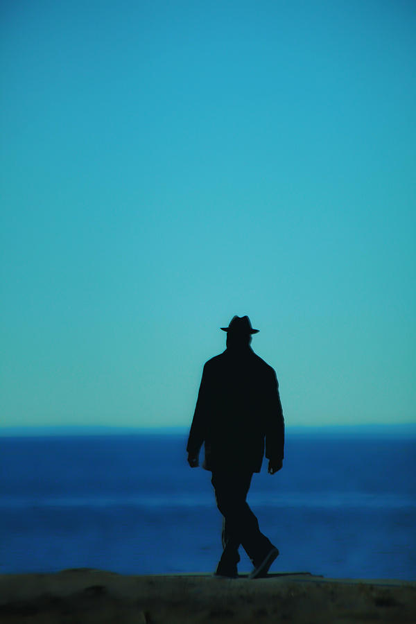 Beach Photograph - Mysterious Man by Karol Livote