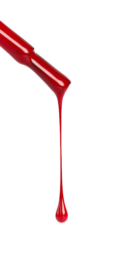 Nail brush with red polish dripping on a white background Photograph by Pederk