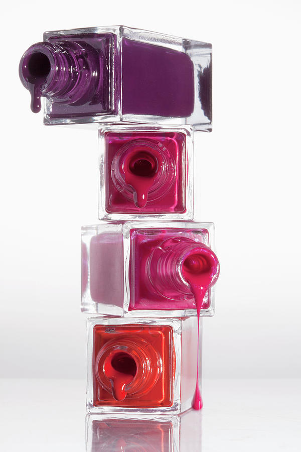 Nail Polish Dripping From A Stack Of Photograph by Larry Washburn