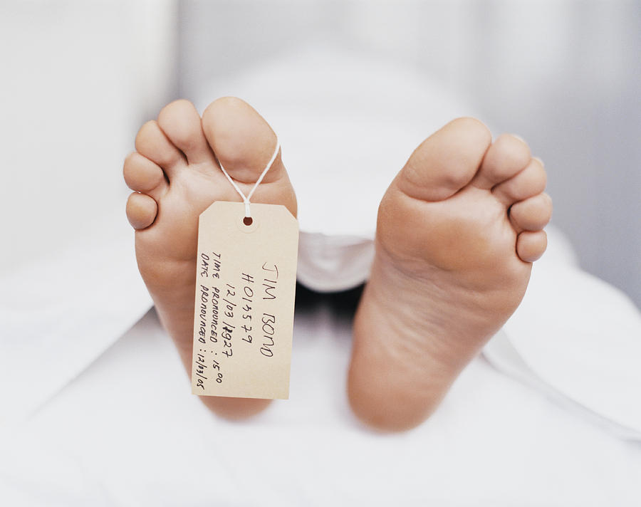 Name Tag Hanging From the Foot of a Dead Body Under a Sheet Photograph by Janie Airey