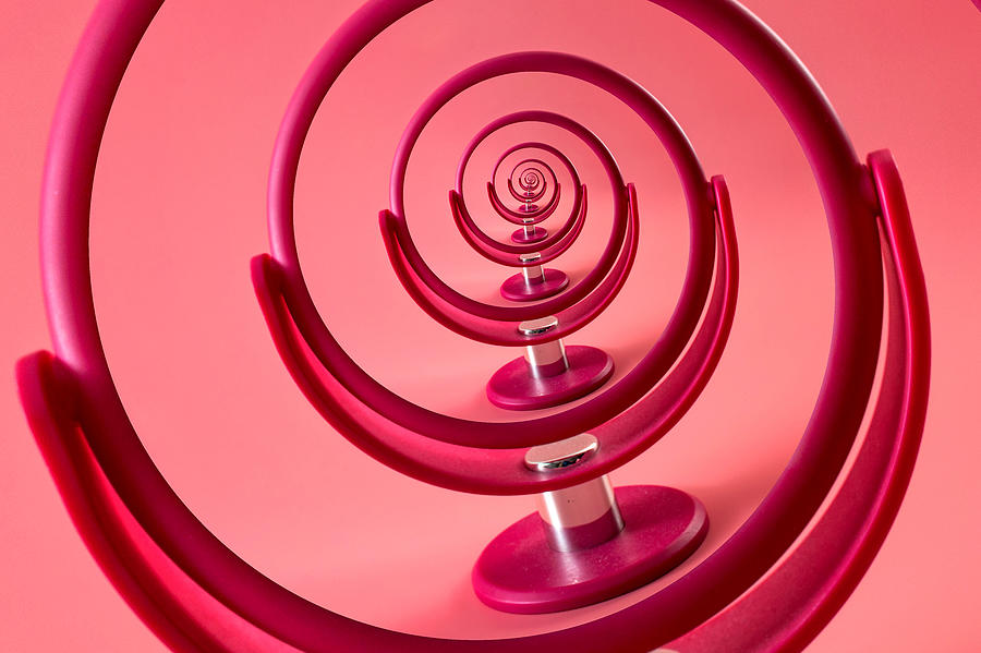 Narcissism and narcissistic personality disorder concept theme with a droste effect on a pink mirror creating a vortex representing the physiological disease spinning out of control Photograph by Moussa81