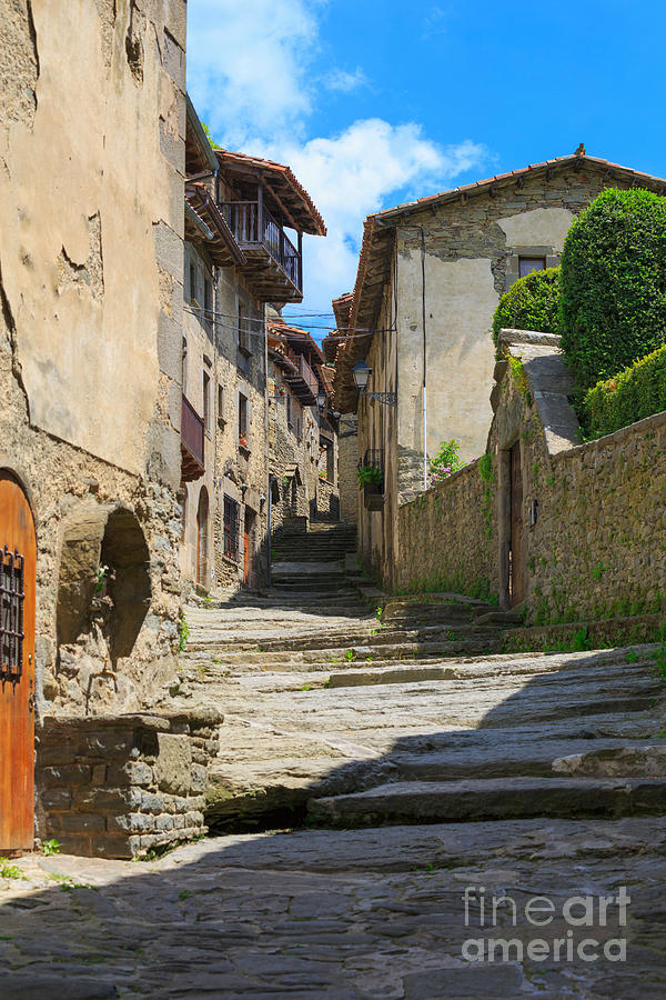 Narrow lane in the medieval town of Rupit in Catalonia Photograph by Louise Heusinkveld