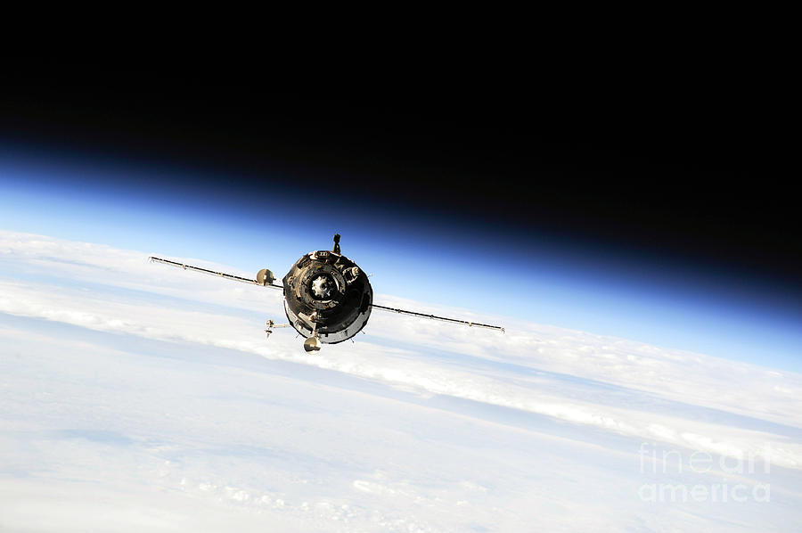 NASA Soyuz Spacecraft Approaches International Space Station Photograph by Rose Santuci-Sofranko