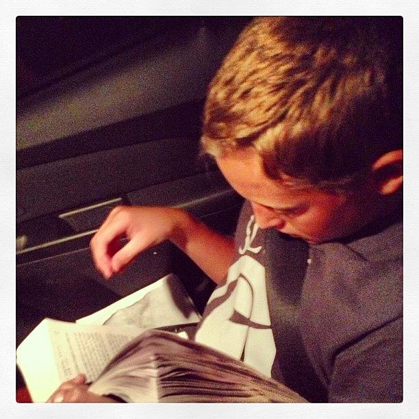 Nathan Reading On Our Way Home. This Photograph by Sarah Steele
