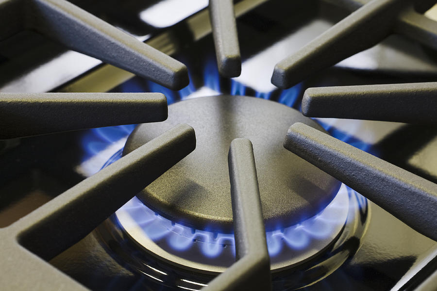 Natural Gas Stove Burner Appliance with Blue Flame Fire Close-up Photograph by YinYang