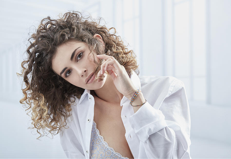 Natural Look Woman With Curly Hair Wearing A White Shirt Photograph by Riccardo Bianchi