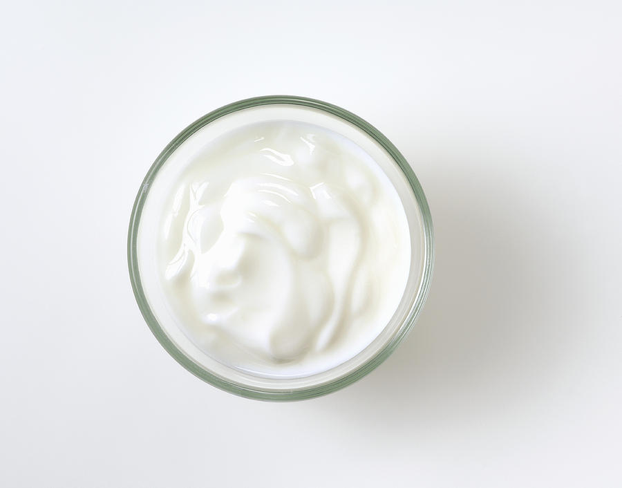 Natural yogurt in glass bowl Photograph by Foodcollection RF
