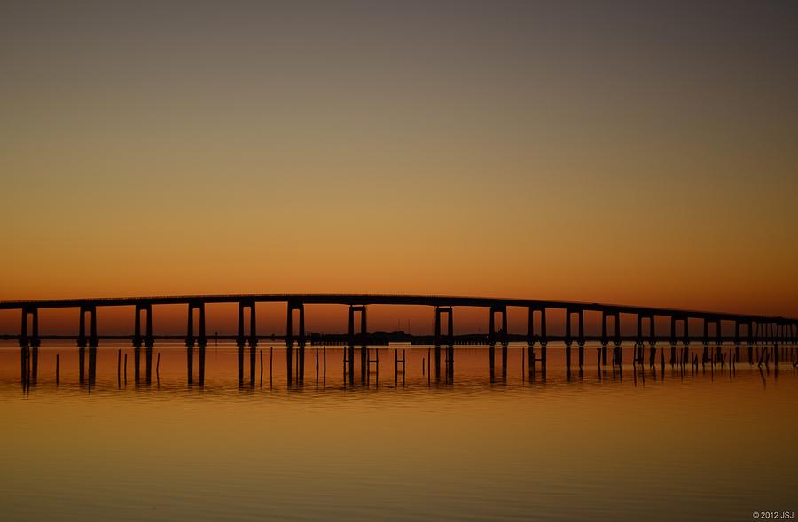 Navarre Beach Bridge Reflections on Dead Calm at Sunrise  Photograph by Jeff at JSJ Photography