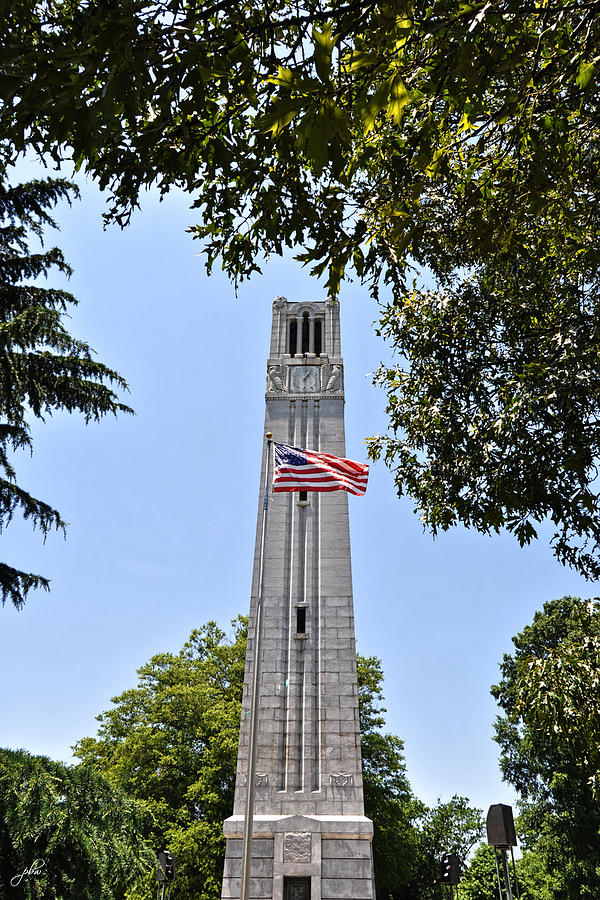 NC State Memorial Bell Tower and US Flag Photograph by Paulette B Wright