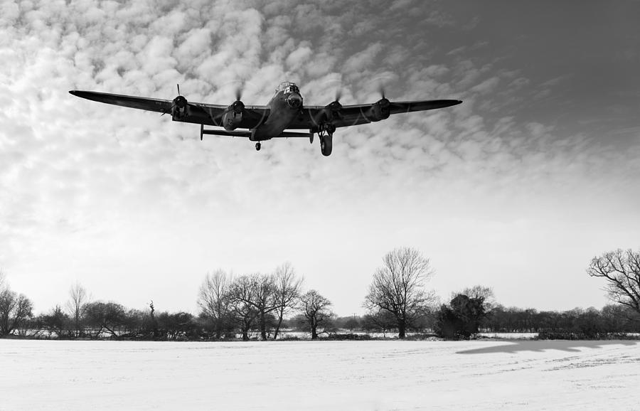 Nearly home - Lancaster limping back in winter black and white v Digital Art by Gary Eason
