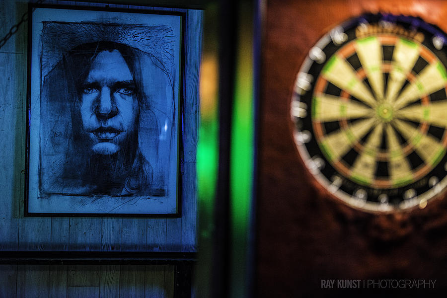 Neil And The Dartboard Photograph by Raymond Kunst