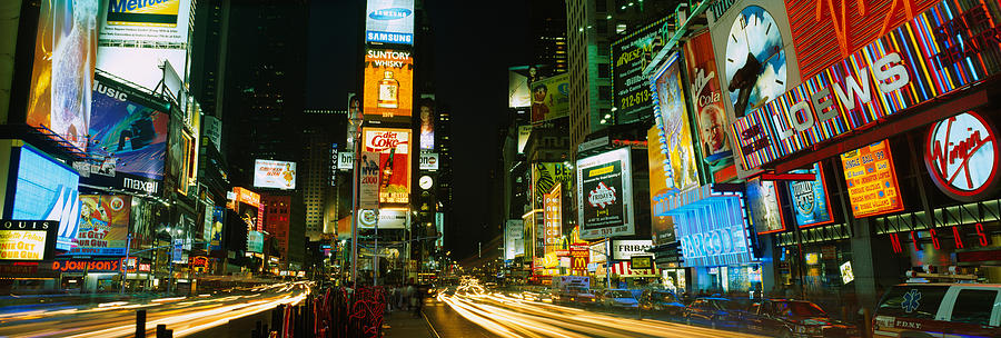 New York City Photograph - Neon Boards In A City Lit Up At Night by Panoramic Images