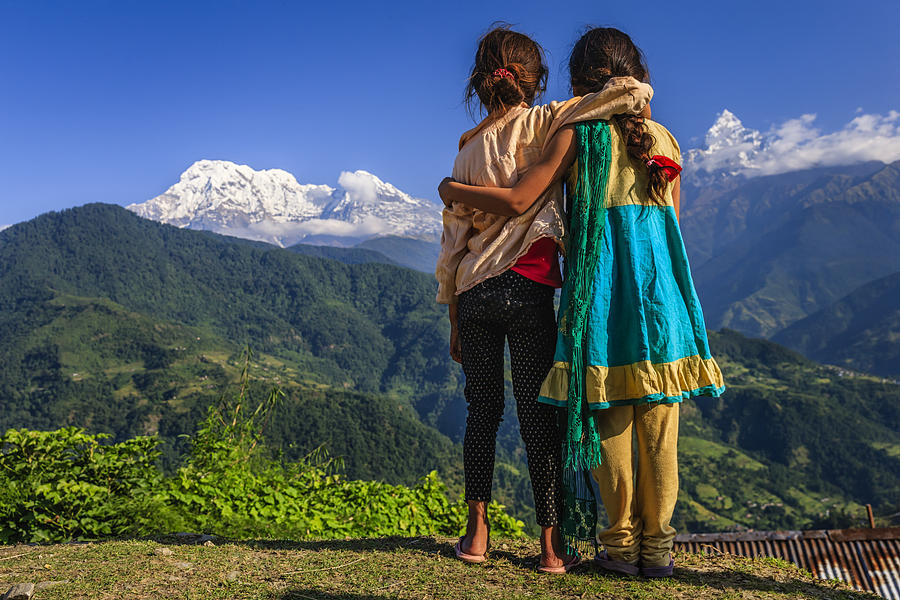 Nepali little girls looking at Annapurna South Photograph by Hadynyah
