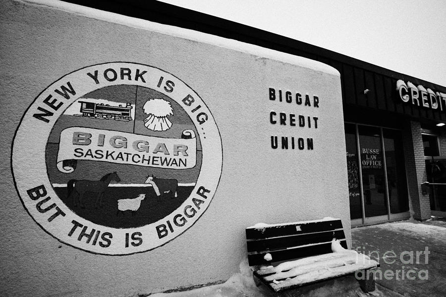 Winter Photograph - new york is big but this is biggar slogan sign Biggar credit union Saskatchewan Canada by Joe Fox