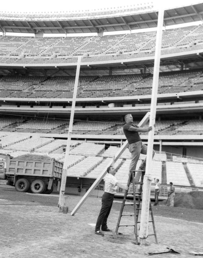 Vintage Photograph - New York Jets Football Crew Works On Field Goal Repairs by Retro Images Archive