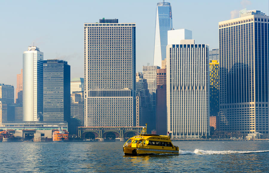 New York Water Taxi Passing Freedom Tower and SI Ferry Terminal Photograph by Maureen E Ritter