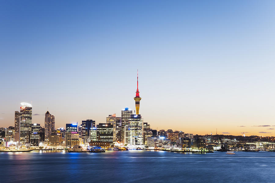 New Zealand, Auckland, Skyline with Sky Tower, blue hour Photograph by Westend61