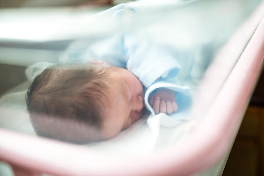 Newborn Baby Sleeping In Hospital Bassinet Photograph by JaCZhou