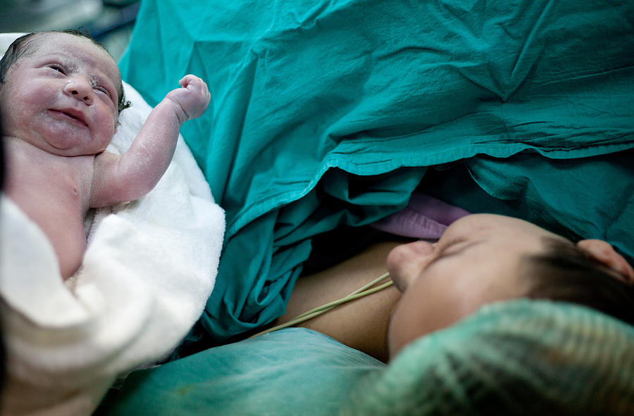 Newborn child seconds and minutes after birth. Photograph by Mustafagull