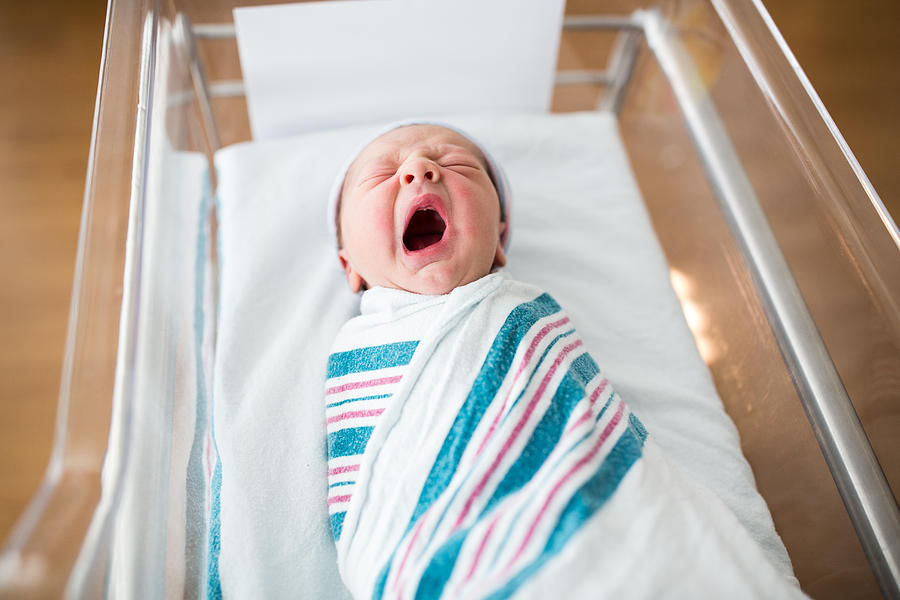 Newborn Infant Yawning in Crib Photograph by Purple Collar Pet Photography