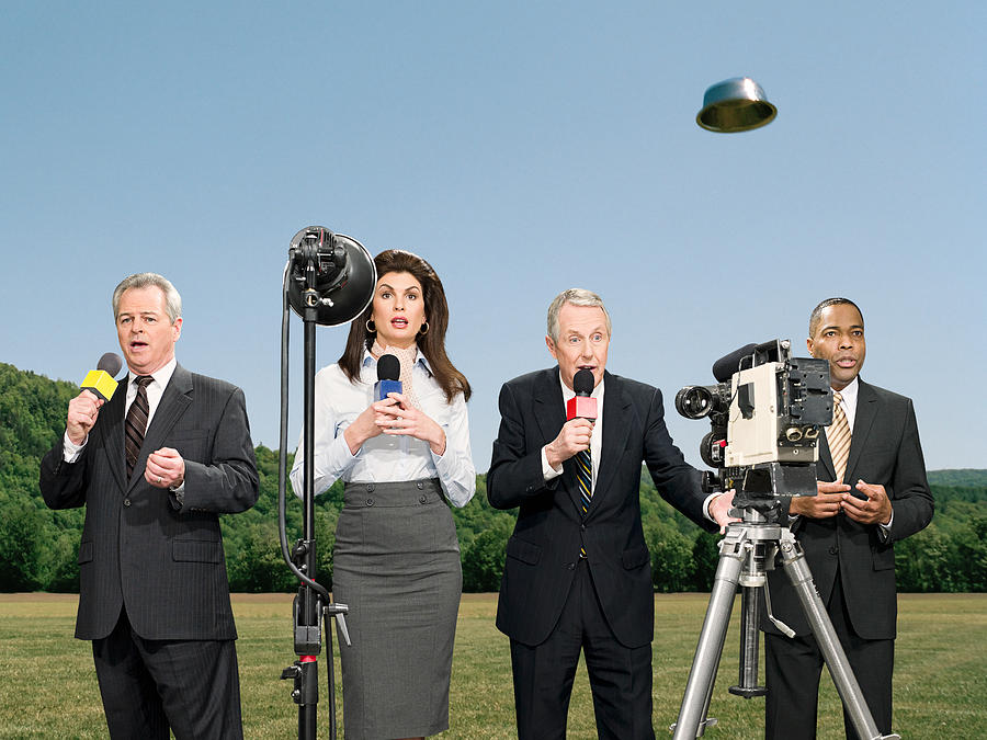 News presenters and ufo Photograph by Image Source