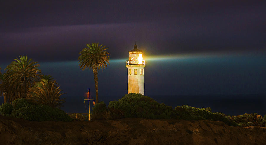 Night Lighthouse on the Bluff Photograph by Jerry Cowart