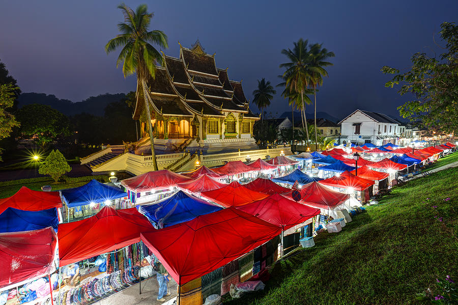 Night market and Haw Pha Bang temple in Luang Prabang Photograph by Tuomas Lehtinen