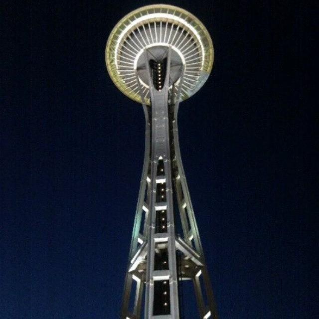 Nightime Underneath The Space Needle Photograph by Dixon Lopez