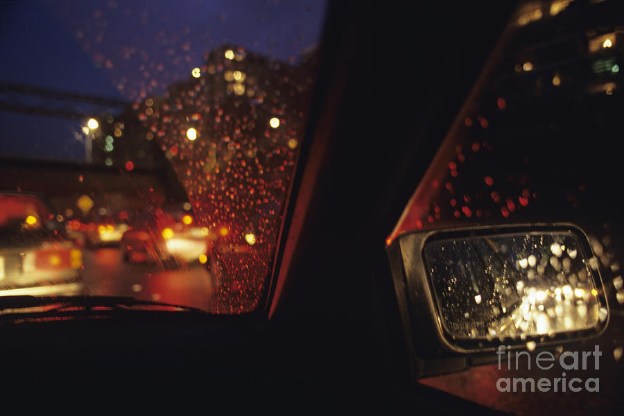 Nighttime driving with City Lights Photograph by Jim Corwin