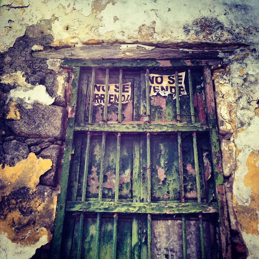 Vintage Photograph - No Se Vende sign on very old window by REO De Jongh