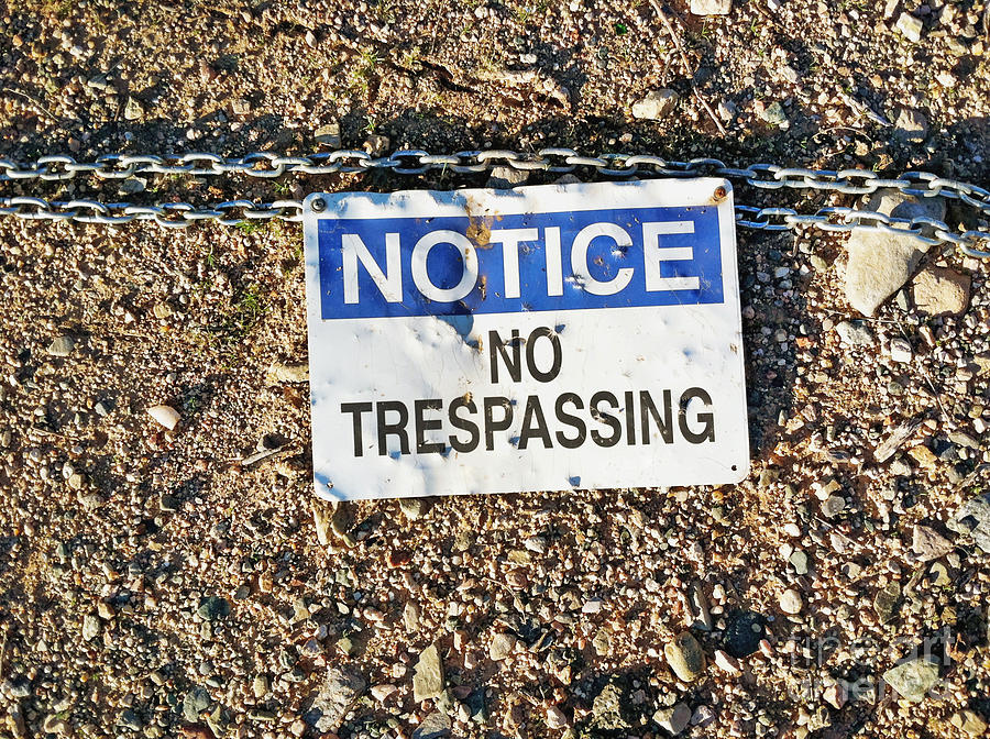 No Trespassing Sign on Ground Photograph by Bryan Mullennix