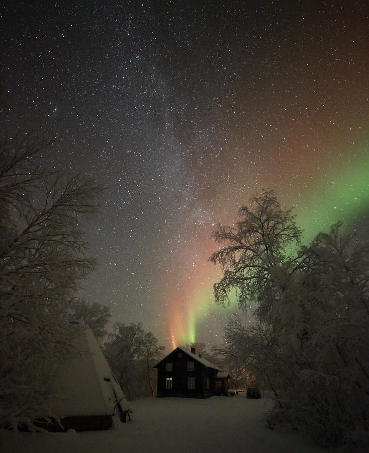 Northern Lights and the Milky Way above an Old House Photograph by Pekka Sammallahti