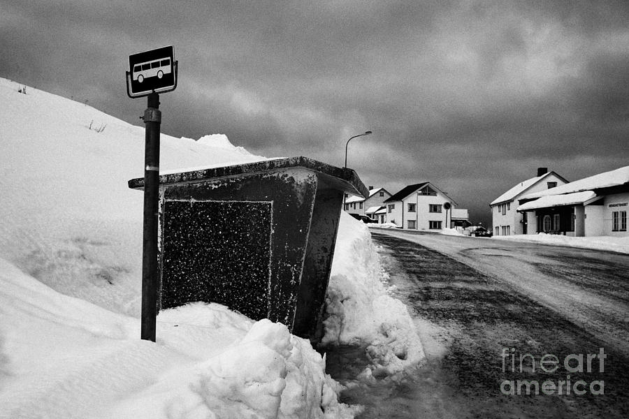 Winter Photograph - norwegian bus stop shelter covered in snow by the side of the road Honningsvag finnmark norway europ by Joe Fox
