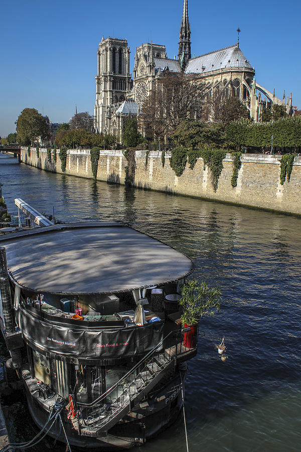 Notre Dame and River Boat Photograph by Glenn DiPaola