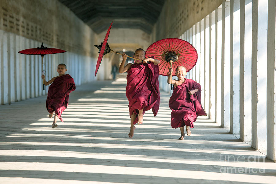 Novice monks on the run - Myanmar Photograph by Matteo Colombo