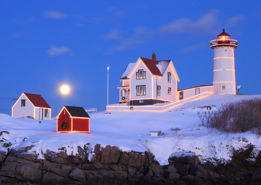 Nubble Lighthouse Full Moon and Holiday Lights Photograph by John Burk