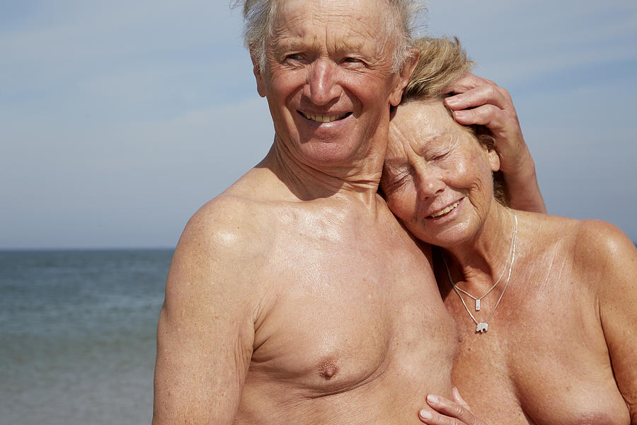 Nude old couple at beach Photograph by Chris Tobin
