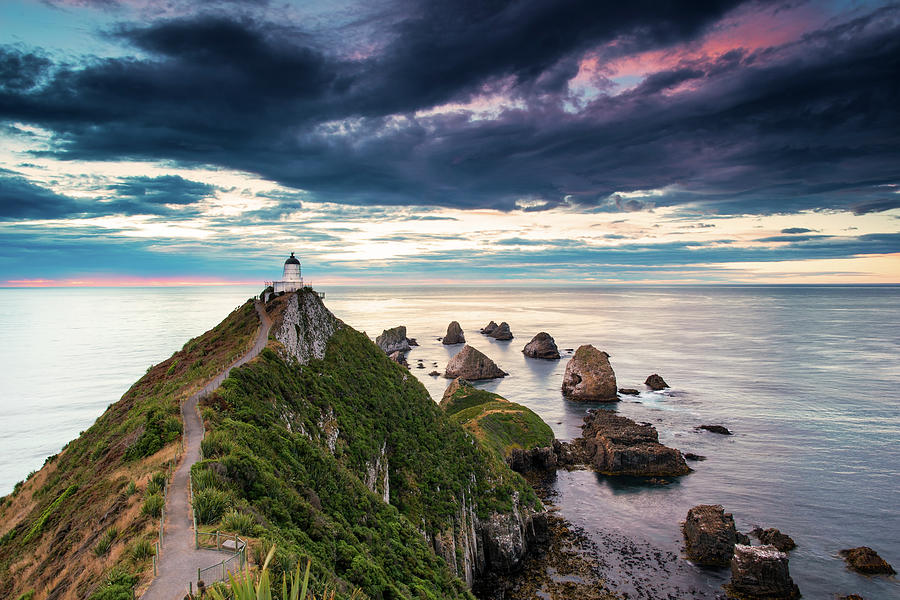 Nugget Point Lighthouse Photograph by Photography By Byron Tanaphol Prukston