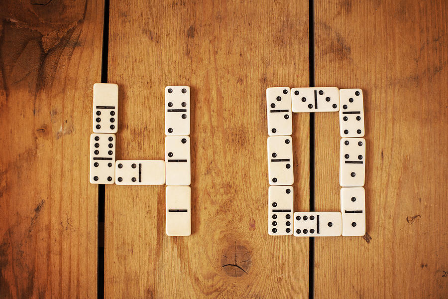 Number 40 with white domino on the wood background Photograph by Yulia Reznikov