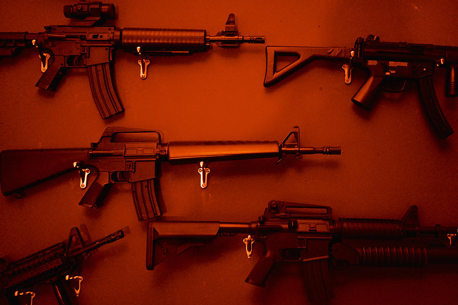 Numerous Assault Rifles Hanging On Wall. Photograph by Ballyscanlon