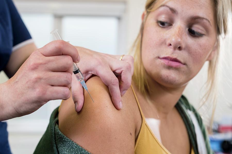 Nurse Administering Hpv Vaccine Photograph by Jim Varney