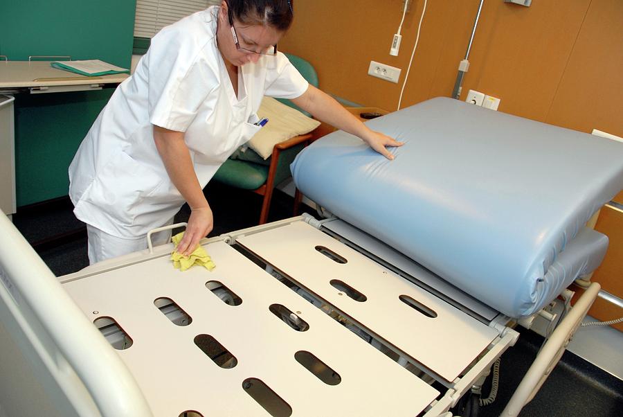 Nurse Cleaning Hospital Bed Photograph by Aj Photo/science Photo Library