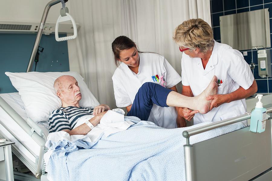 Nurses Examining Patient Photograph by Arno Massee/science Photo ...