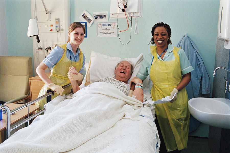 Nurses With Patient Photograph by Mark Thomas/science Photo Library