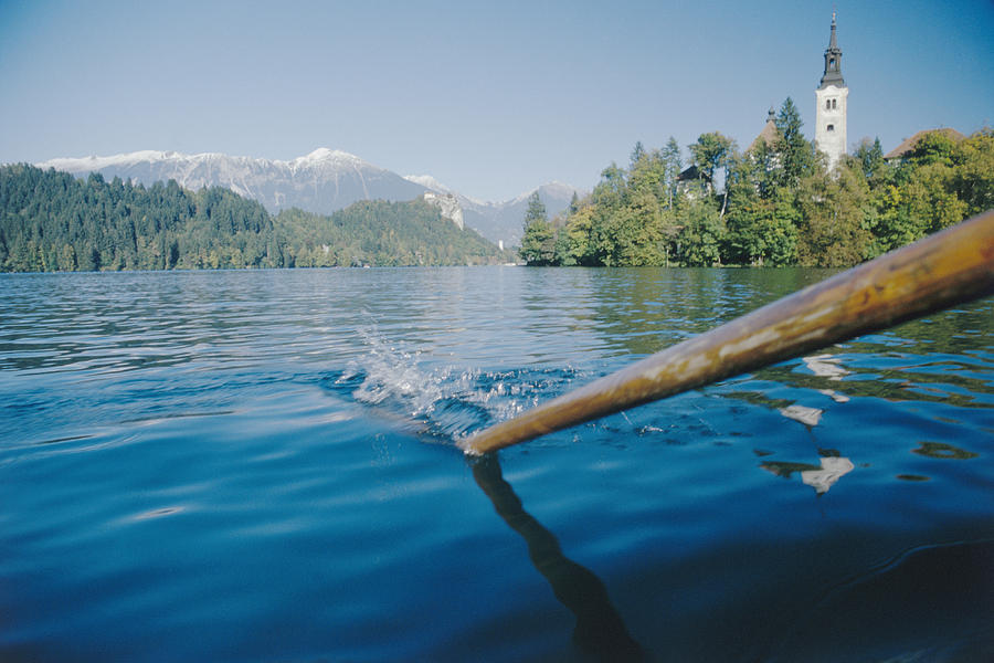 Oar in Lake Photograph by Heidi Coppock-Beard