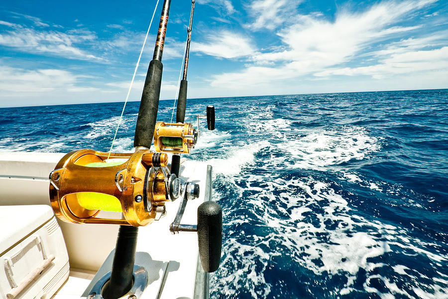 Ocean Fishing Reels on a Boat in the Ocean Photograph by Grandriver